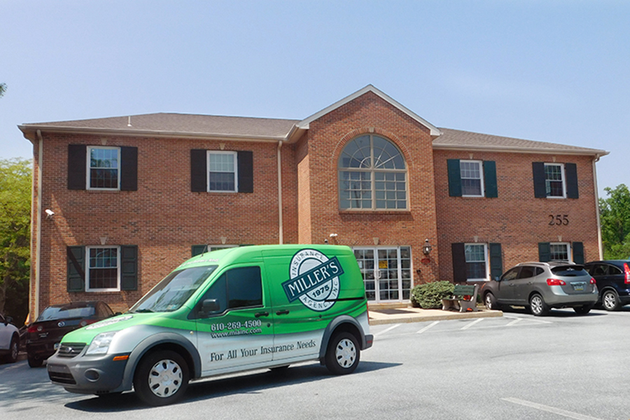 About Our Agency - Millers Insurance Agency Van Parked in Front of Their Large Brick Office Location in Downingtown, Pennsylvania